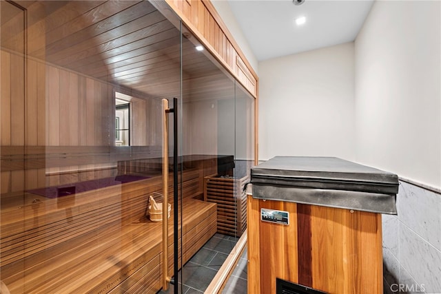 view of sauna / steam room with tile patterned floors, a wainscoted wall, and recessed lighting