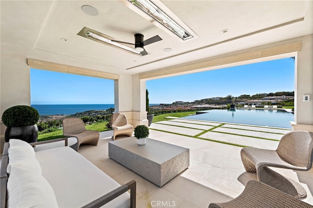 view of patio / terrace with a water view and outdoor lounge area