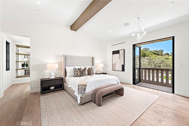 bedroom featuring access to exterior, a notable chandelier, lofted ceiling with beams, and wood finished floors