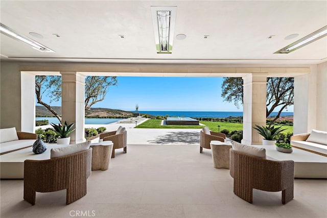 view of patio featuring an outdoor living space and a water view