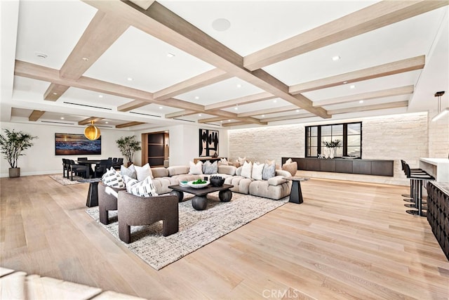 living room with beam ceiling, coffered ceiling, and light wood-type flooring