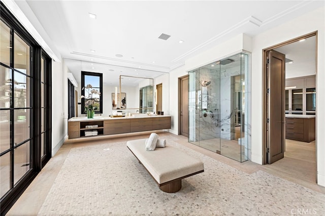 full bath with visible vents, a stall shower, vanity, and crown molding