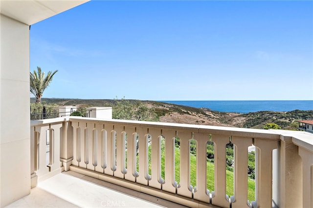 balcony featuring a water view