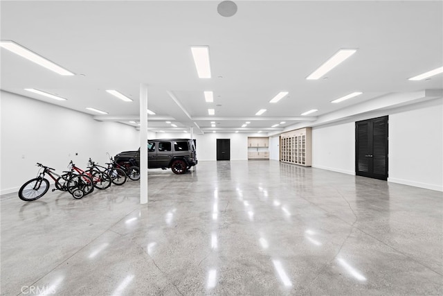 garage with bike storage and baseboards