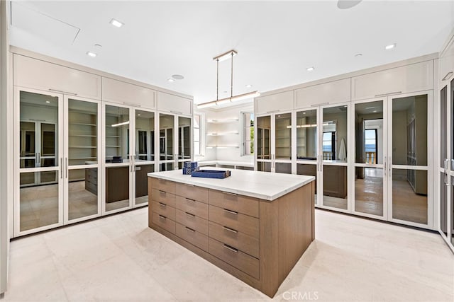 walk in closet featuring french doors