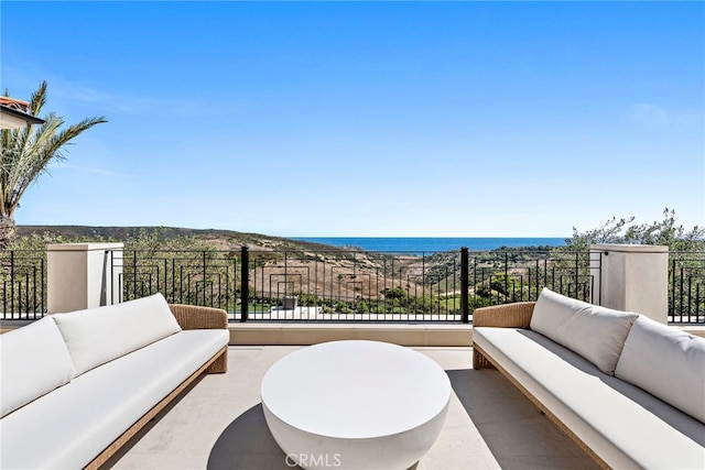 view of patio featuring an outdoor living space and a water view