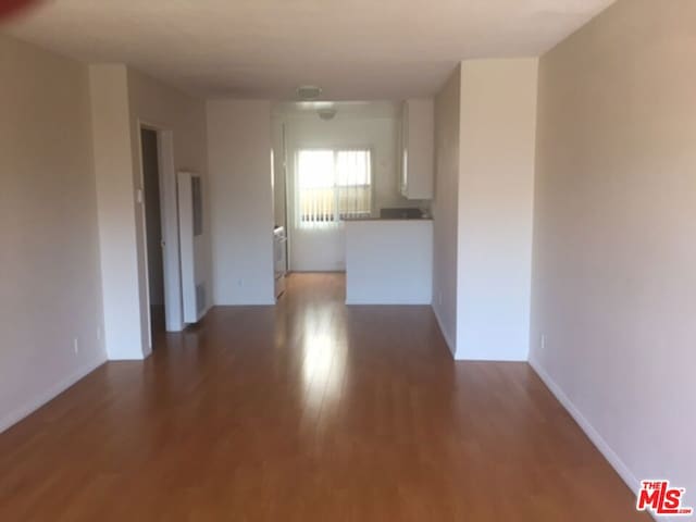 spare room featuring hardwood / wood-style floors