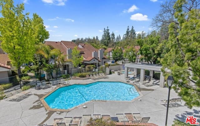 view of pool featuring a pergola and a patio area