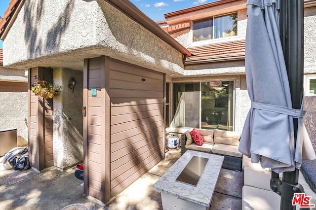 exterior space with outdoor lounge area