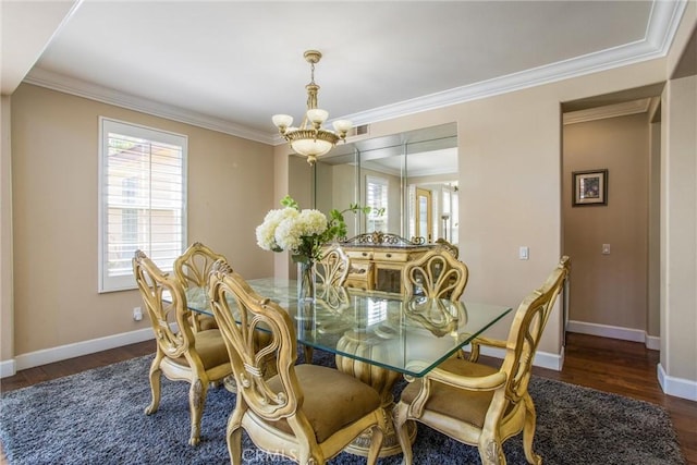 dining room with a chandelier, dark hardwood / wood-style floors, and crown molding