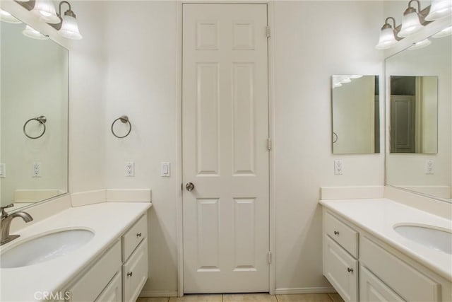 bathroom with tile patterned flooring and vanity