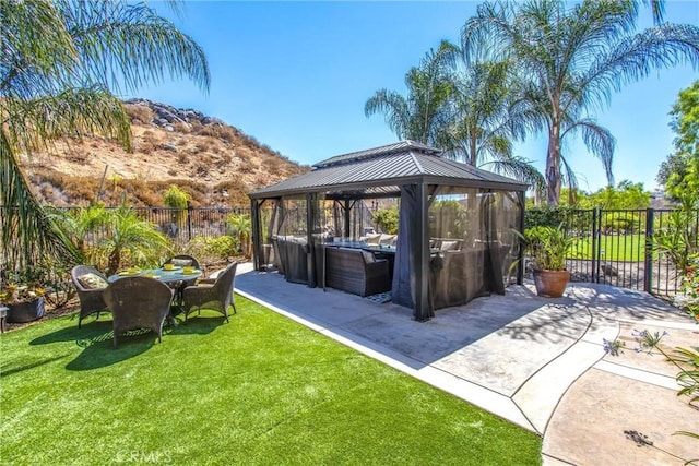 view of patio with a gazebo and a mountain view