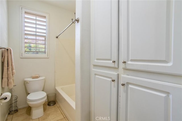 bathroom with tile patterned floors, toilet, and bathtub / shower combination