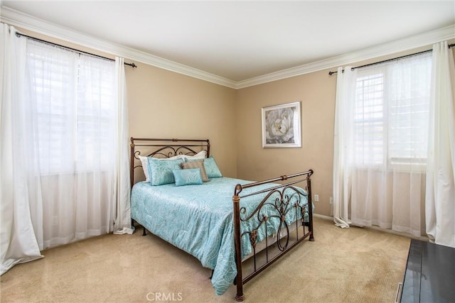 bedroom featuring light colored carpet and ornamental molding