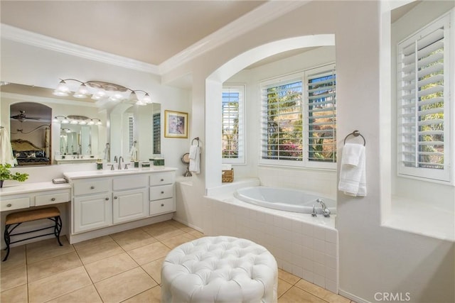 bathroom featuring tile patterned flooring, vanity, a relaxing tiled tub, and ornamental molding