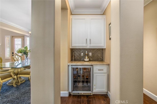 bar featuring decorative backsplash, white cabinetry, wine cooler, and dark hardwood / wood-style floors