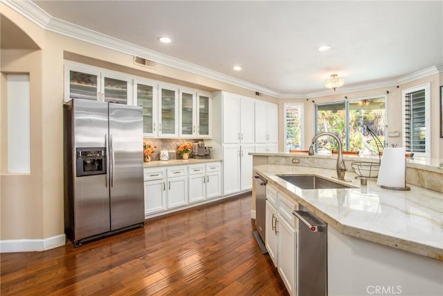 kitchen featuring light stone counters, stainless steel appliances, sink, white cabinets, and dark hardwood / wood-style floors