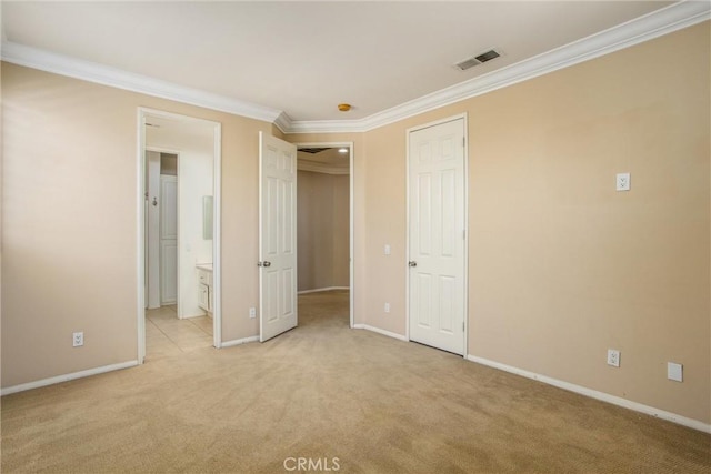 unfurnished bedroom featuring light carpet, connected bathroom, and ornamental molding