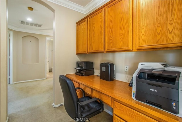 carpeted home office with ornamental molding