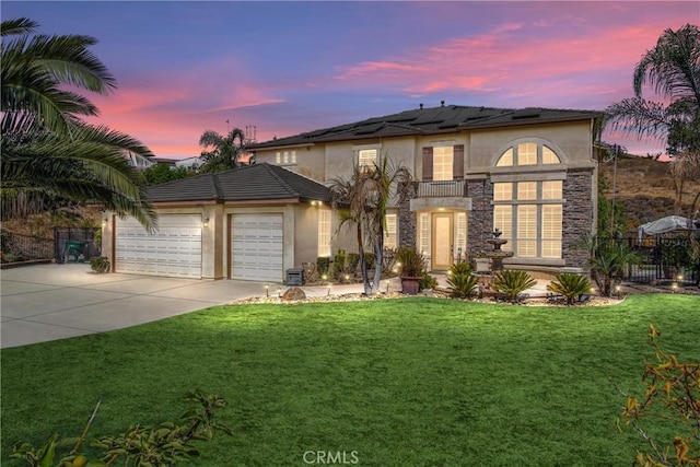 view of front of house with a lawn and a garage