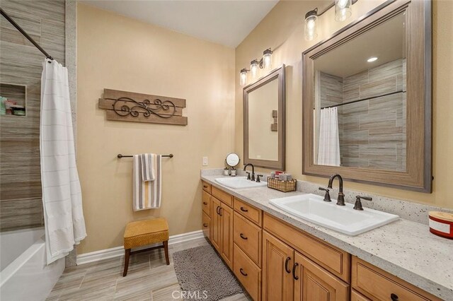 bathroom featuring vanity and shower / tub combo