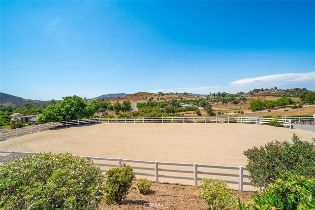 view of property's community featuring a mountain view and a rural view