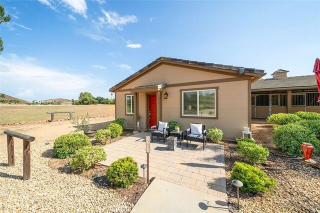 view of front of home with a patio