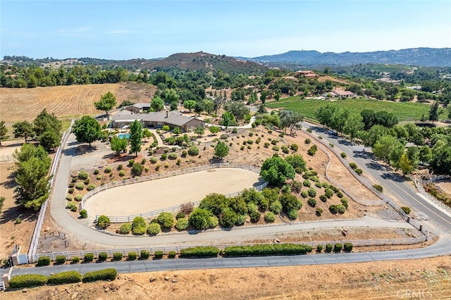 birds eye view of property with a mountain view and a rural view