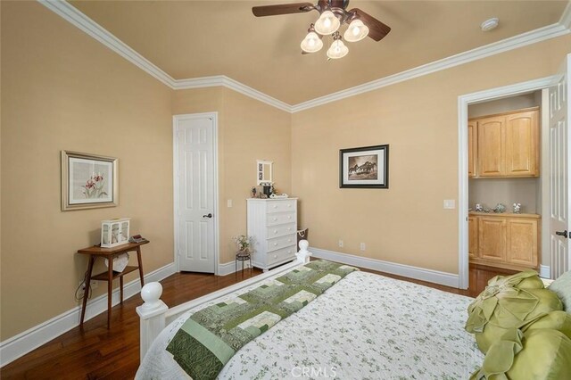 bedroom with dark hardwood / wood-style flooring, ceiling fan, and crown molding