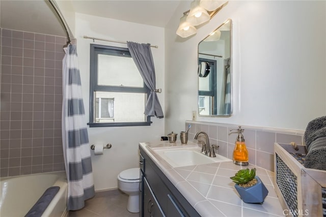 full bathroom with vanity, tile patterned floors, decorative backsplash, shower / bath combo, and toilet