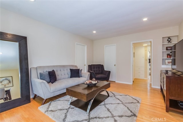 living room with light hardwood / wood-style flooring