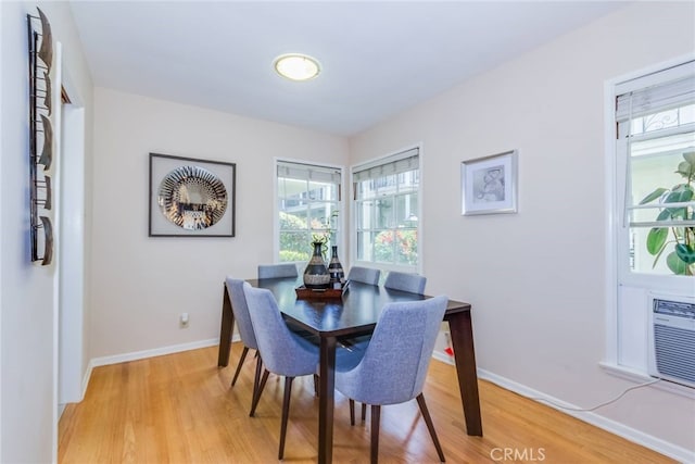 dining area with light hardwood / wood-style floors