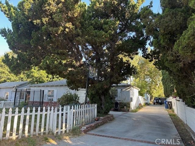 exterior space with a fenced front yard