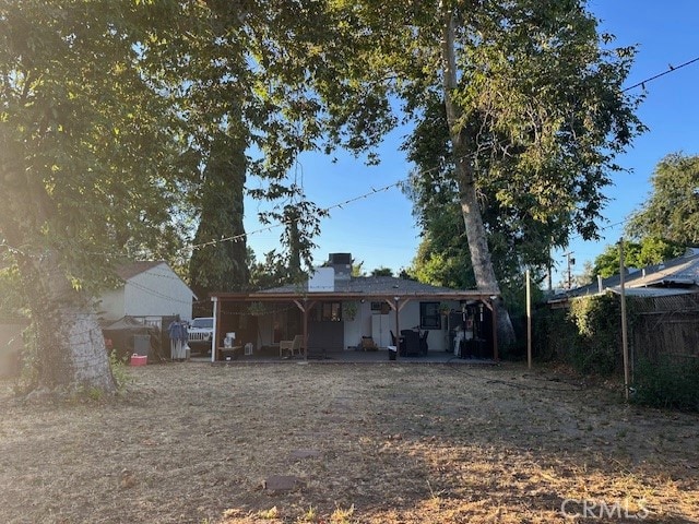 rear view of property featuring a carport