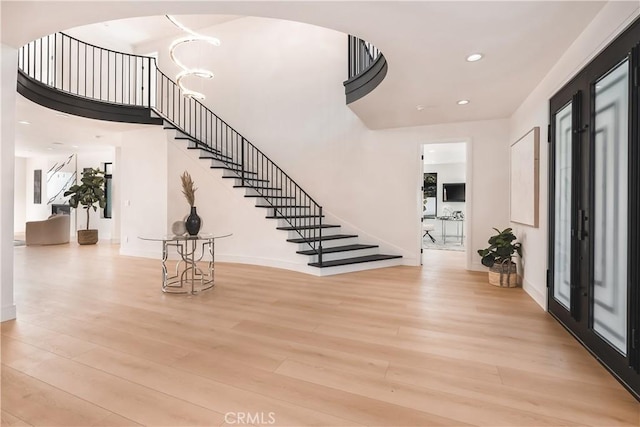 entrance foyer featuring french doors and light wood-type flooring