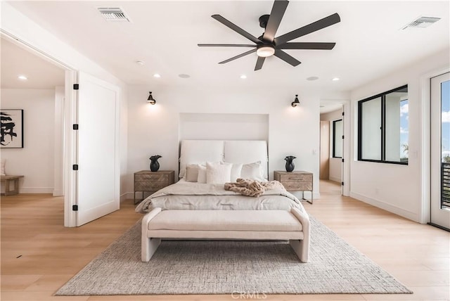 bedroom featuring ceiling fan, light hardwood / wood-style floors, and access to outside