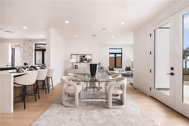 dining room with light hardwood / wood-style flooring