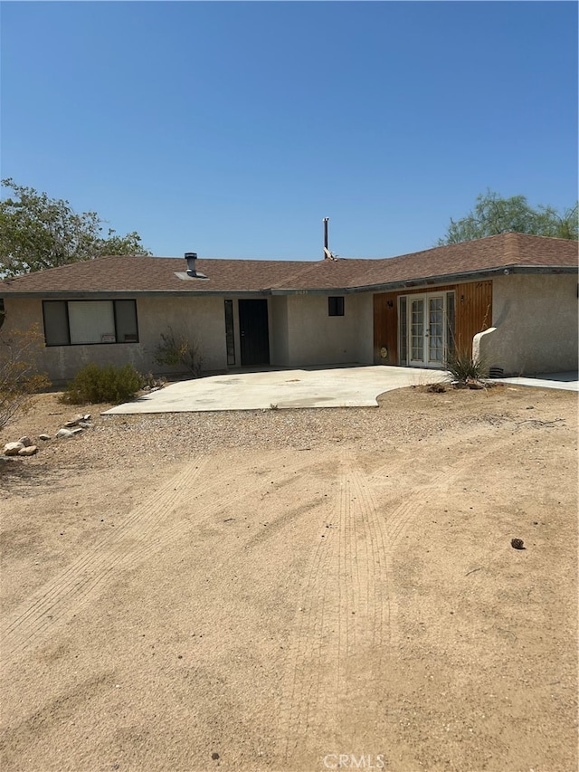 view of front of home featuring french doors and a patio