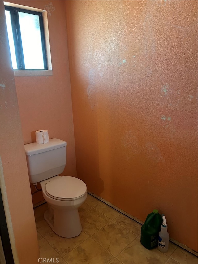 bathroom with tile patterned flooring and toilet