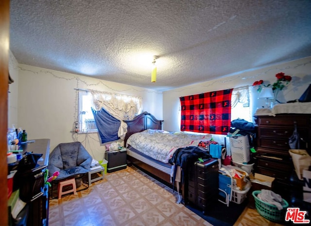 bedroom featuring a textured ceiling