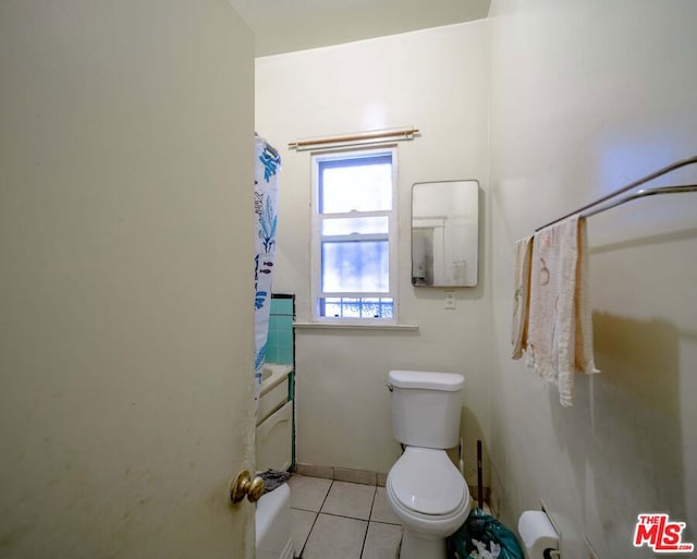 bathroom with tile patterned floors and toilet