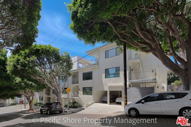 view of front of property with a balcony