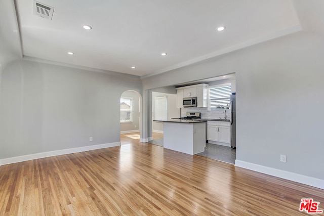 unfurnished living room featuring light wood-type flooring