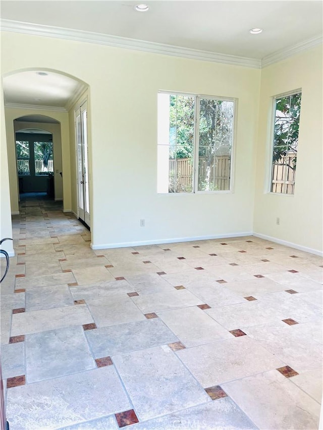 empty room with plenty of natural light and crown molding