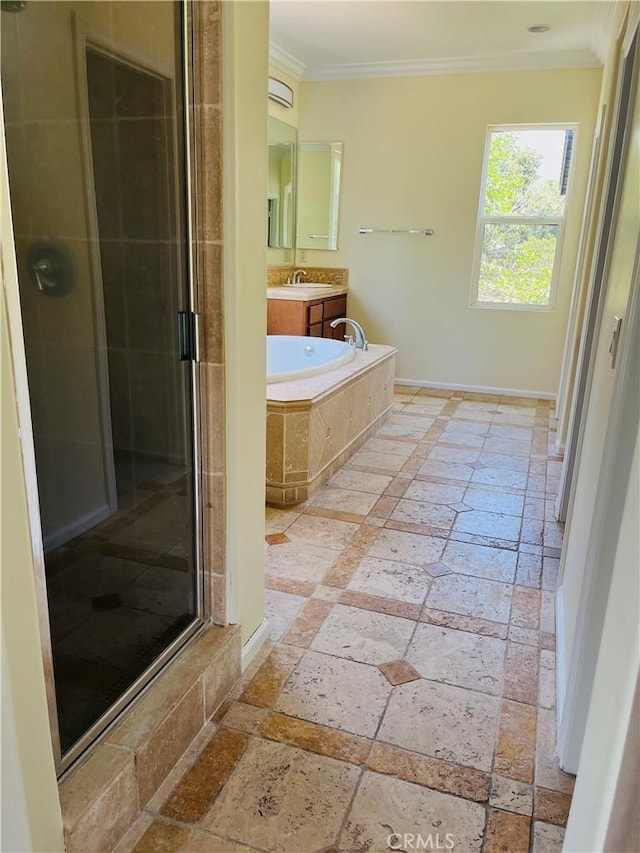 bathroom featuring independent shower and bath, ornamental molding, and vanity