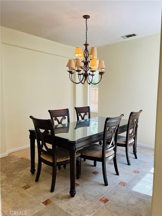 dining room featuring a notable chandelier