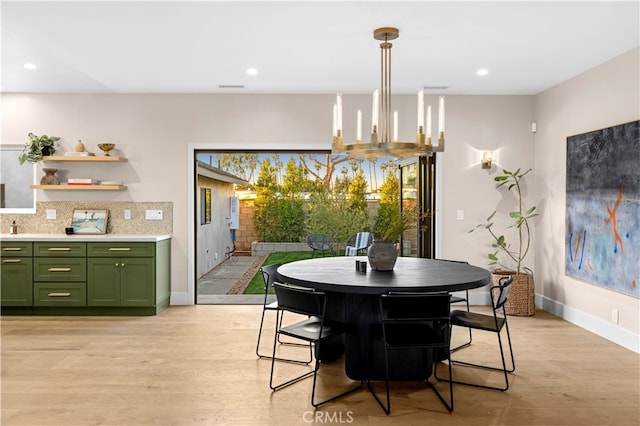 dining area with light hardwood / wood-style flooring and a wealth of natural light