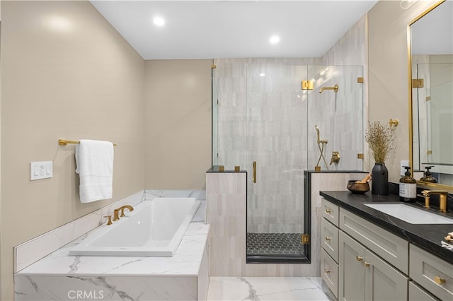 bathroom featuring shower with separate bathtub and vanity