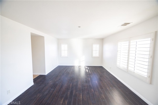 spare room featuring hardwood / wood-style floors