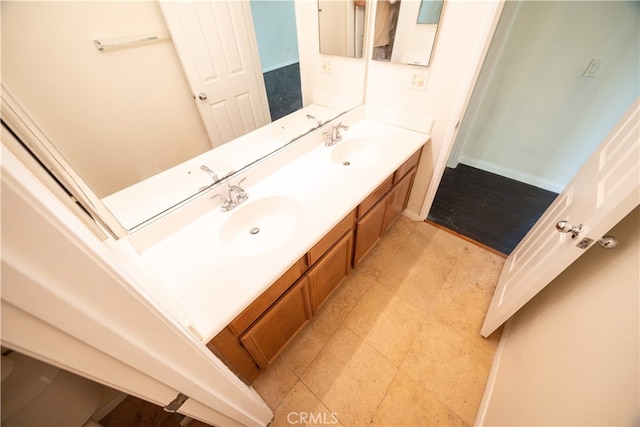 bathroom with dual vanity and tile patterned floors